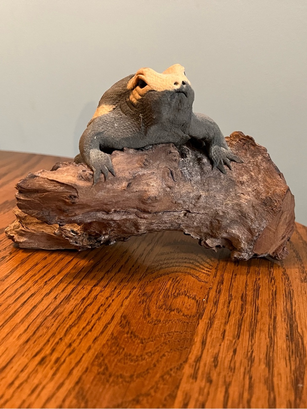 Modern statue of a Frog on driftwood
